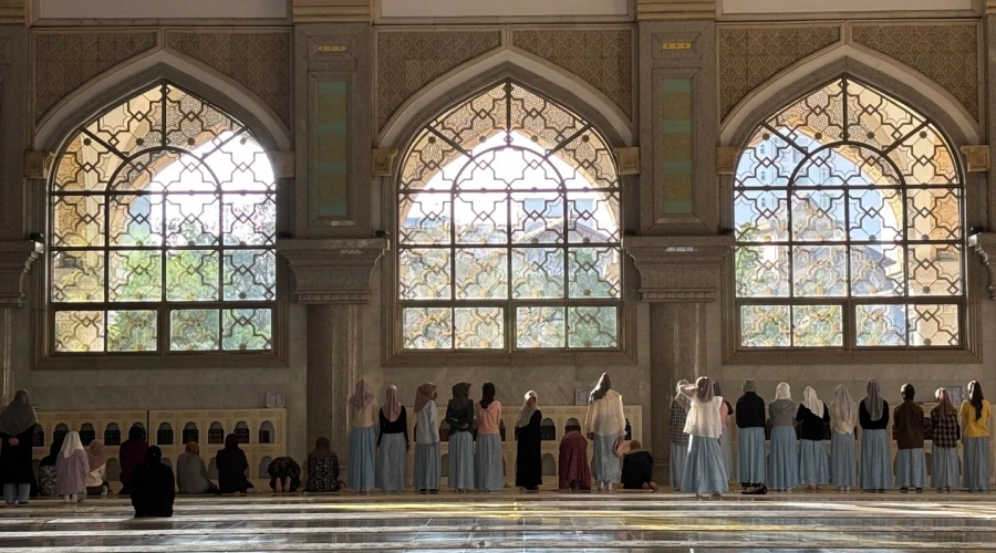 Women gather for prayer inside the grand hall of Shadian Grand Mosque in Yunnan