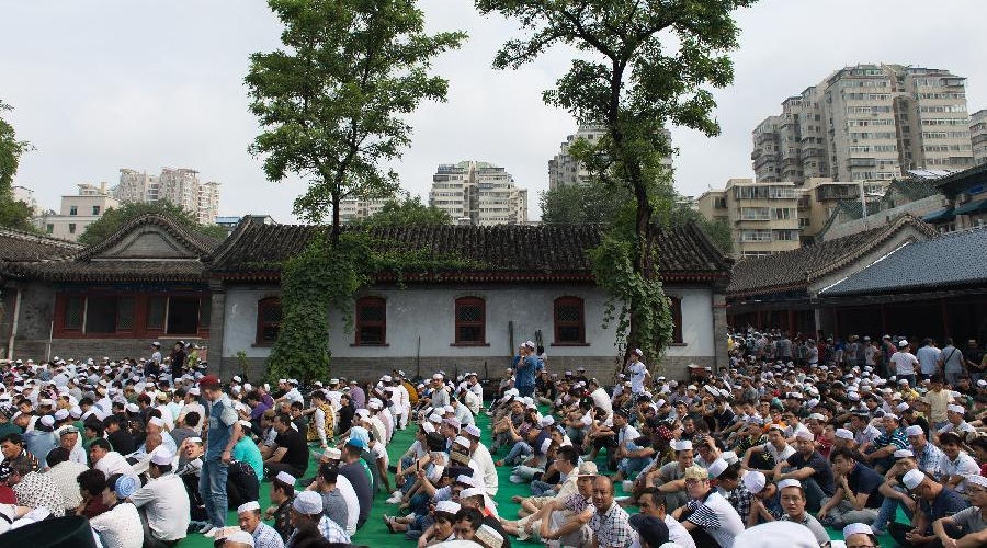 Muslims prepare to pray at the Ox Street Mosque in Moring in Beijing, China