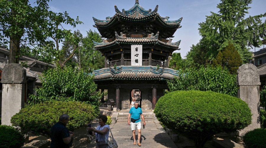 Visitors explore Xi'an's Great Mosque, one of China's most distinctive Islamic landmarks