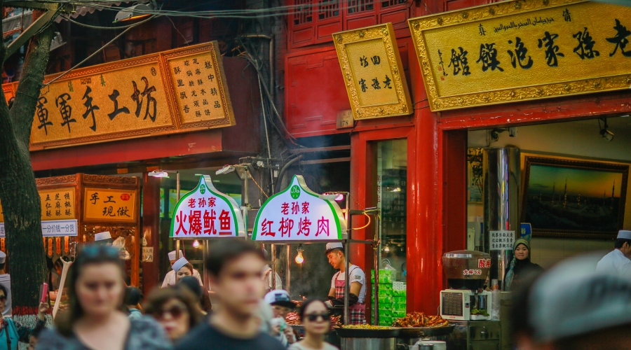 The street is packed with traditional halal food stores in Xi'an Muslim Street.