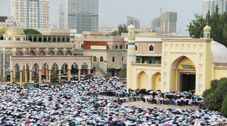 Thousands of Muslims gather for Eid al-Fitr prayers at Id Kah Mosque in Xinjiang